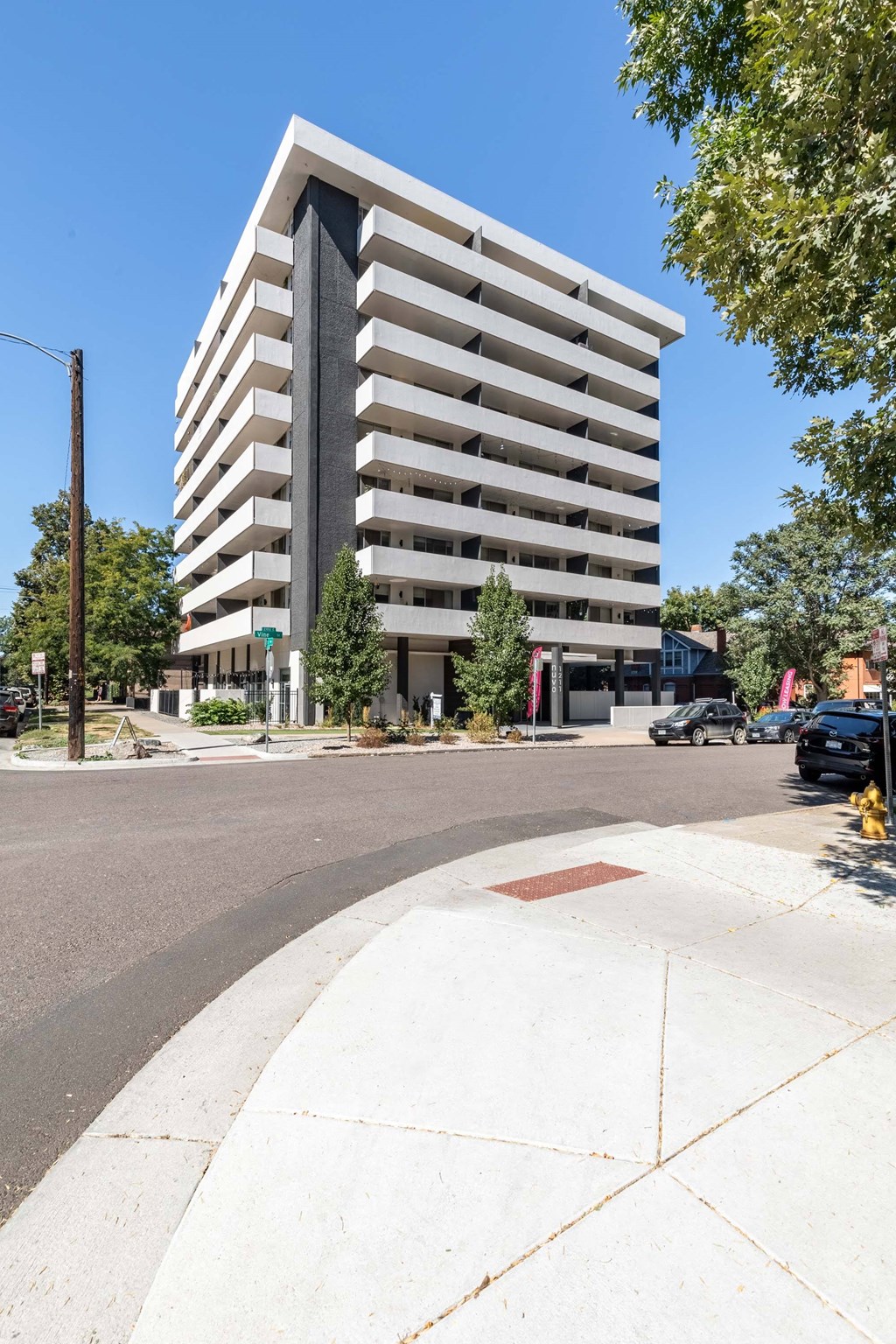 an apartment building on the corner of a street