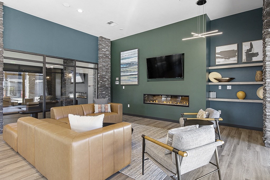 a living room with couches and chairs,