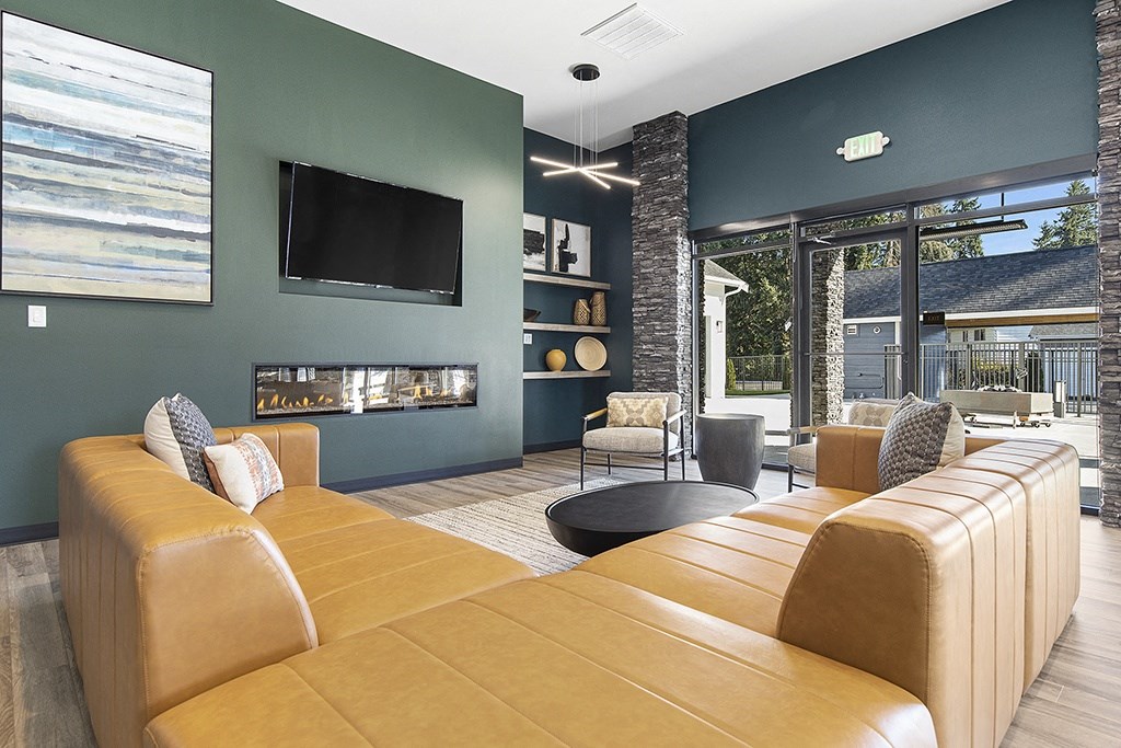 a living room with couches and chairs,