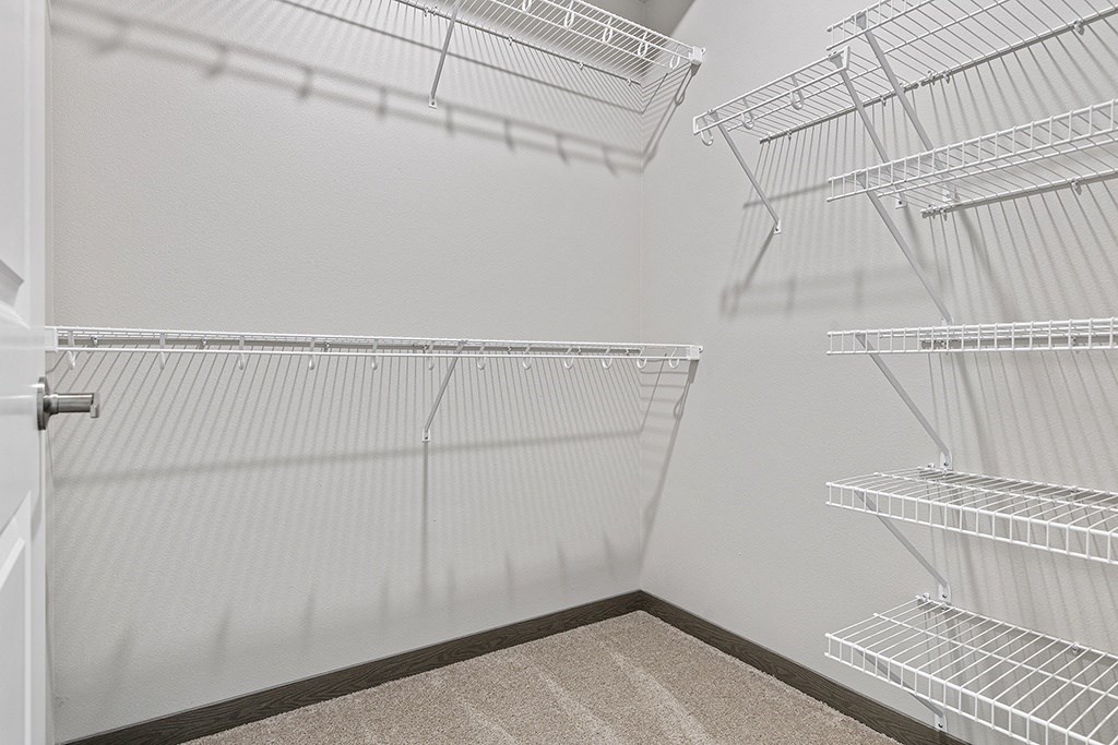 the spacious walk in closet in the third bedroom of our studio apartment atrium suite,