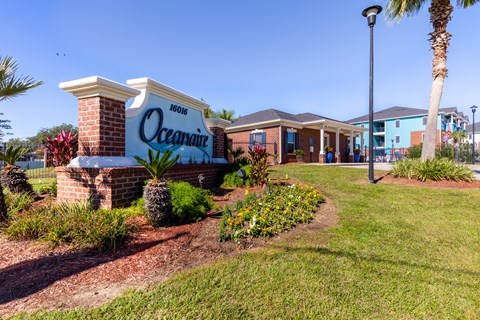 A sign that says Oceanaire in front of a building.