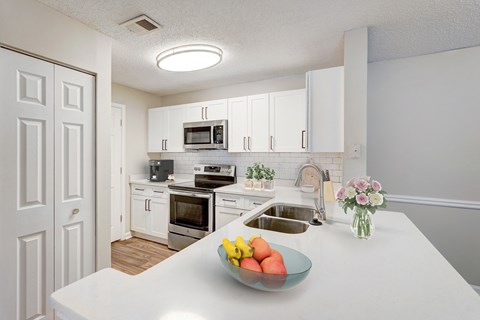 Apartments in Atlanta Georgia for Rent – One K Apartments - A kitchen with a bowl of fruit on the counter.
