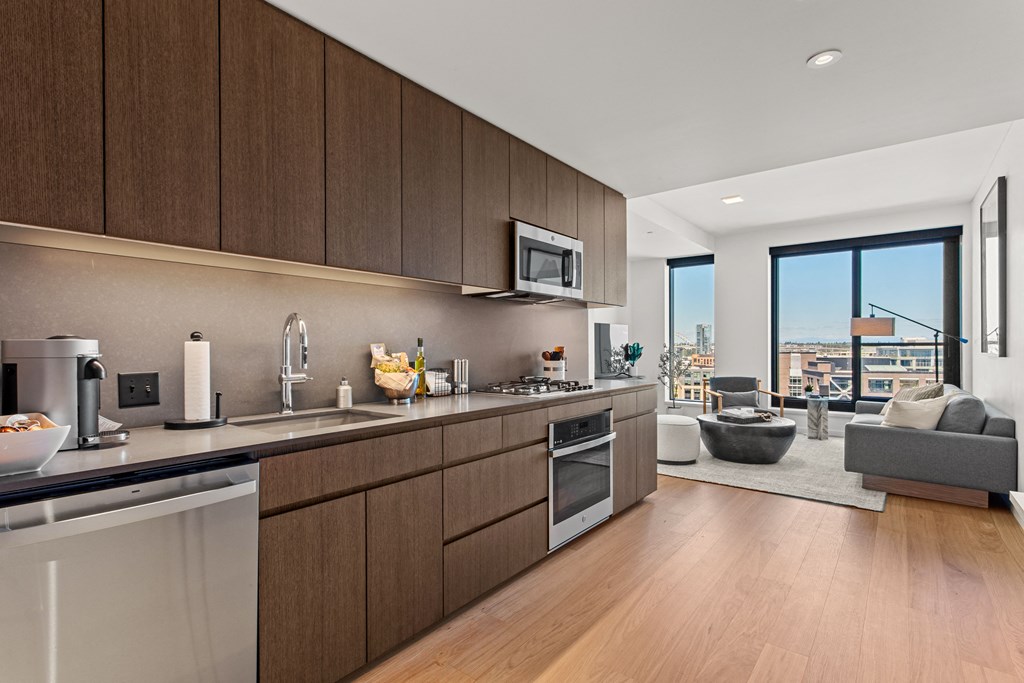 a kitchen and living room in a 555 waverly unit