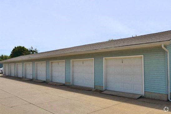 a row of garage doors on the side of a building