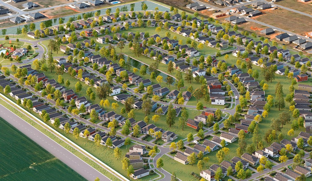 an aerial view of a neighborhood with rows of houses and trees