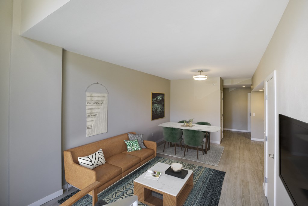 a living room and dining room with a couch and a table