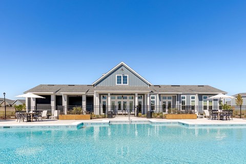 Resort-inspired swimming pool with seating at Outpost Orchard in Foley, AL.