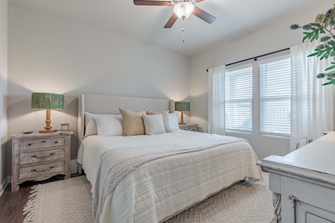 Large living room with ceiling fan next to the kitchen at Outpost Orchard in Foley, AL.