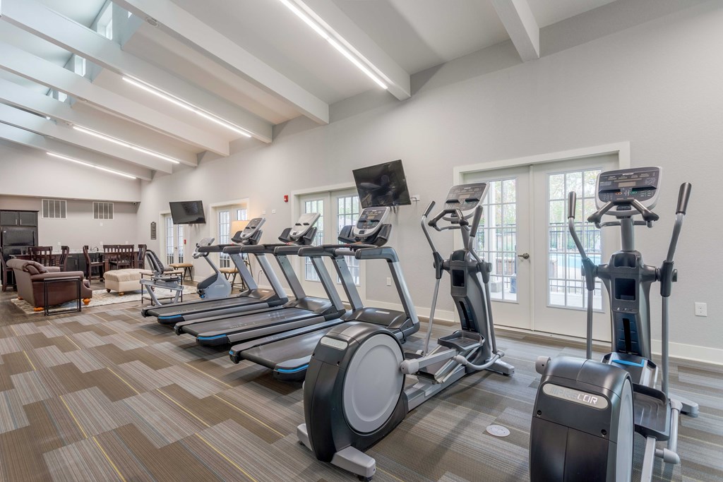 Pet-Friendly Rentals in Sevierville, TN – Overlook at Allensville – A gym with treadmills, elliptical machines, and a television.