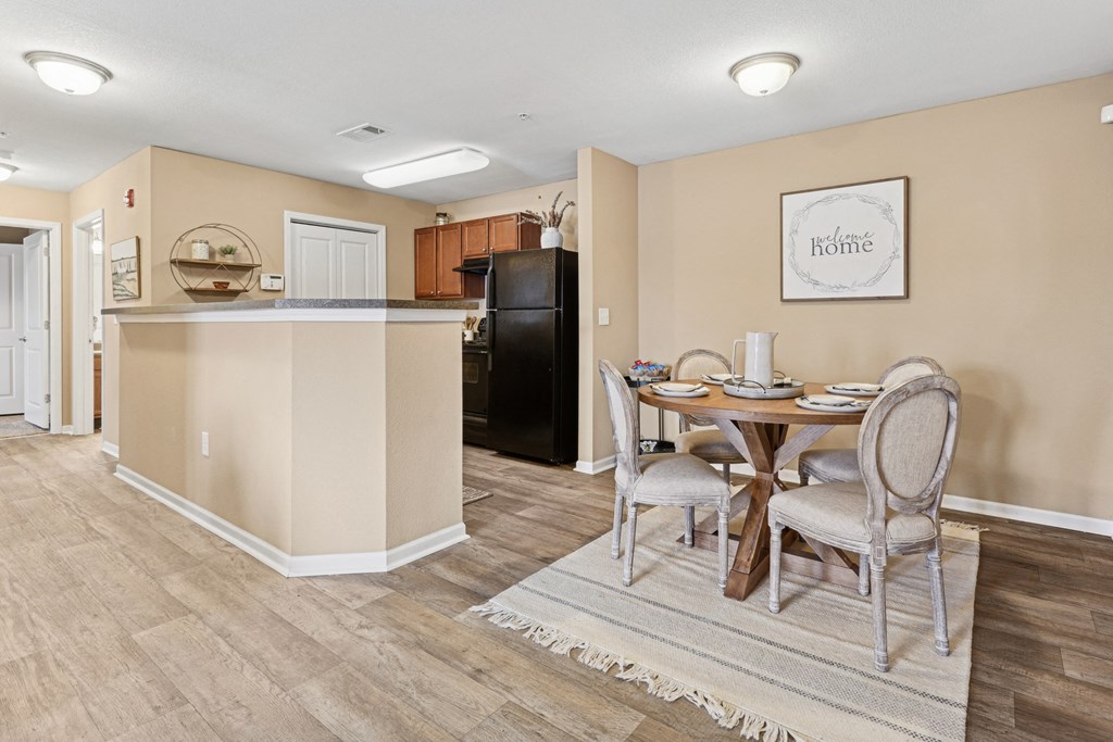 Apartments in Sevierville for Rent – Overlook at Allensville - A kitchen with a table and chairs in the middle of the room.