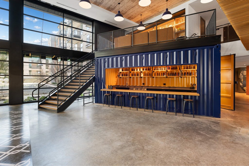 A blue container is used as a bar in The Laura community lounge.