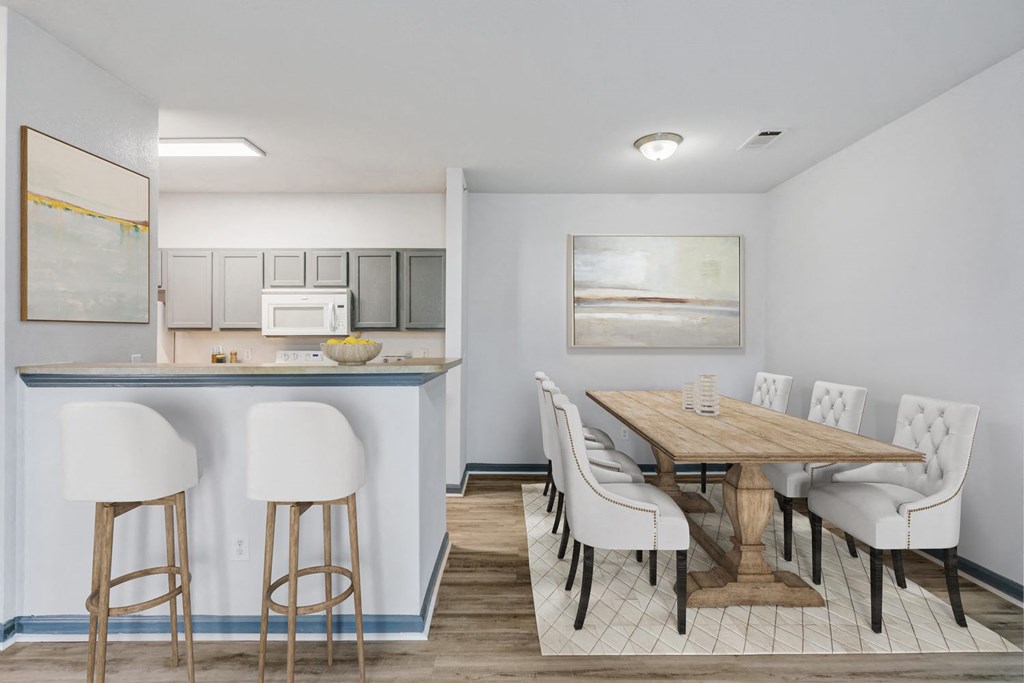 Nashville, TN Apartments - Parc at Metro Center - Kitchen with gray cabinets and dining room
