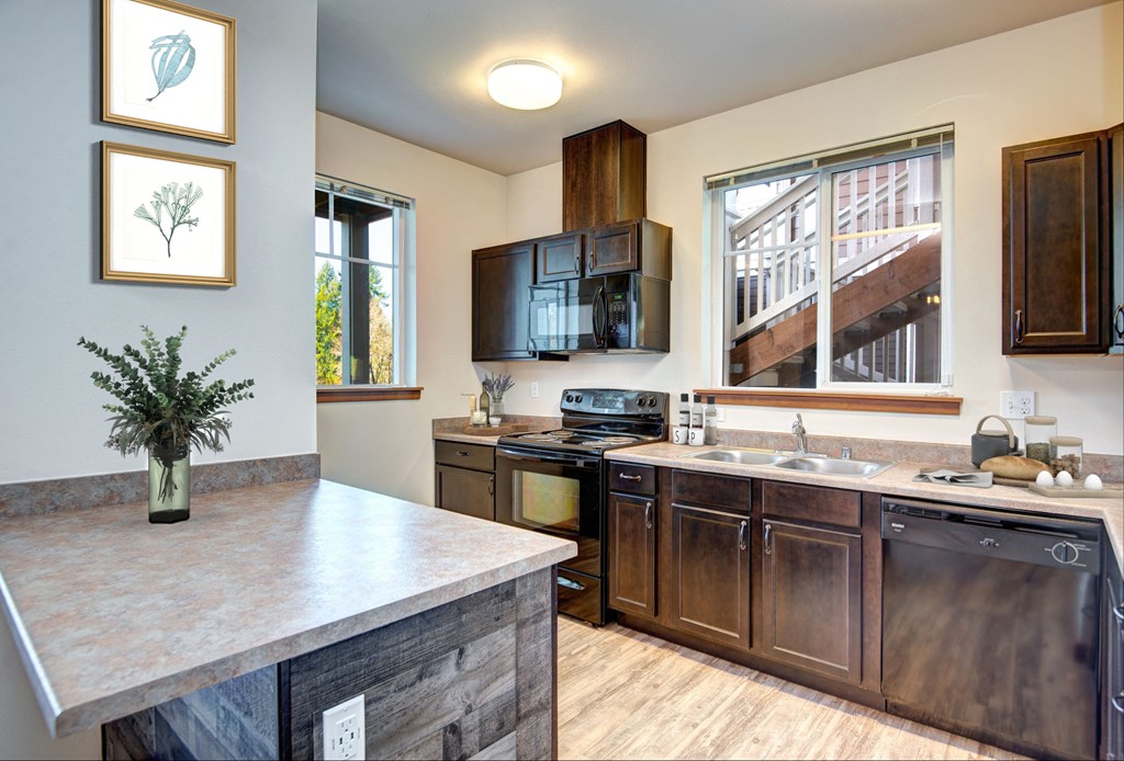 a kitchen with wooden cabinets and a counter top