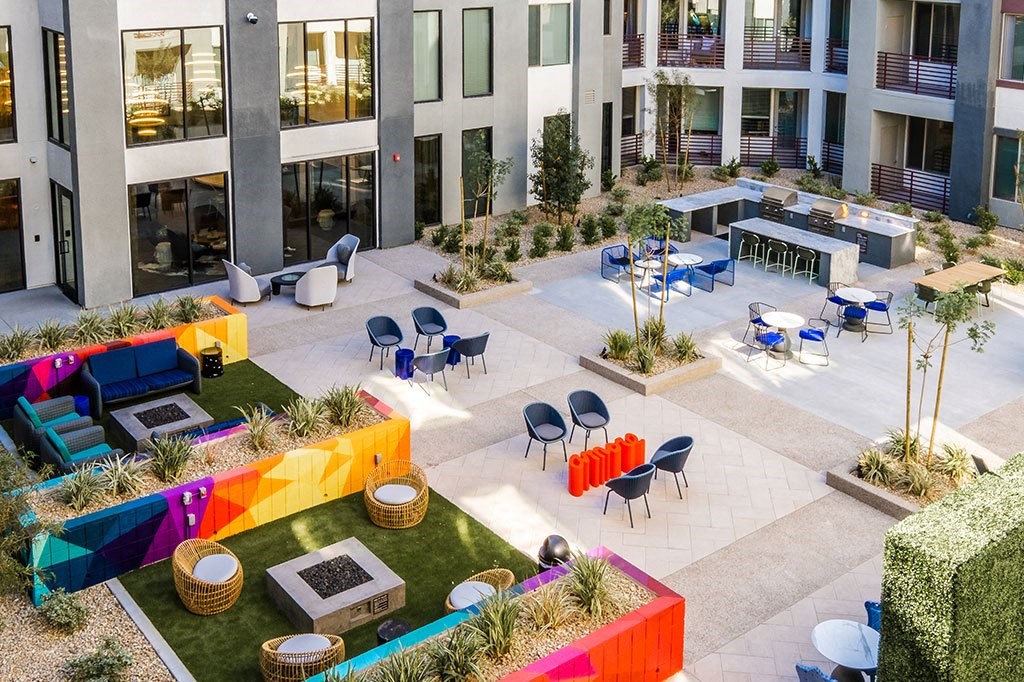 an aerial view of the courtyard of an office building with tables and chairs