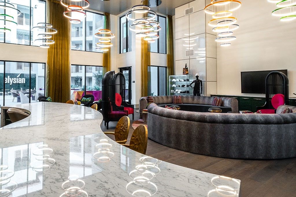 a large lobby with couches and chairs and a table