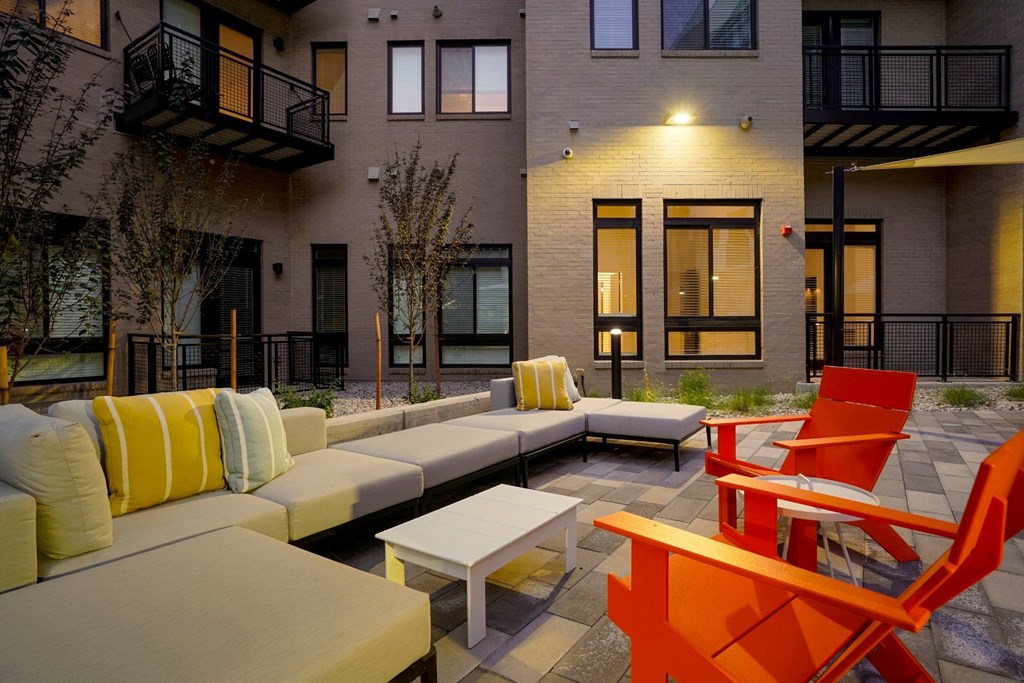 an outdoor lounge space at The Parallel apartments