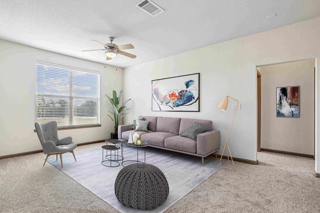 Apartments for Rent in Bentonville, AR 72713– Parc at Bentonville -   Living Room with ceiling fan and large windows