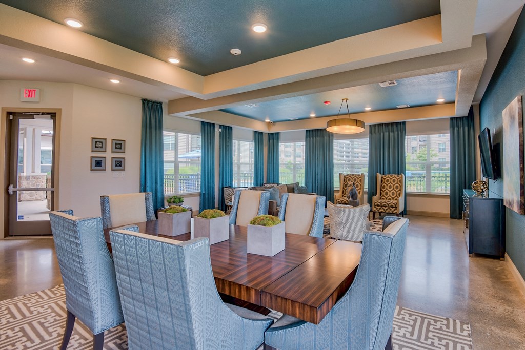 The Clubhouse with a table and seats at Parc at Bentonville