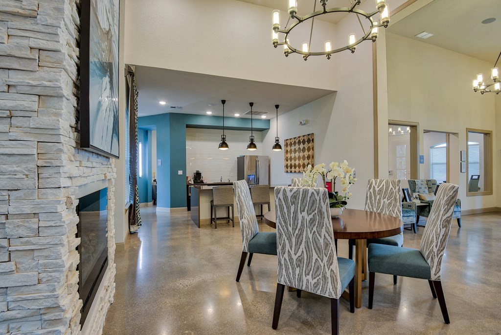 The Clubhouse with a table and seats and coffee bar at Parc at Bentonville