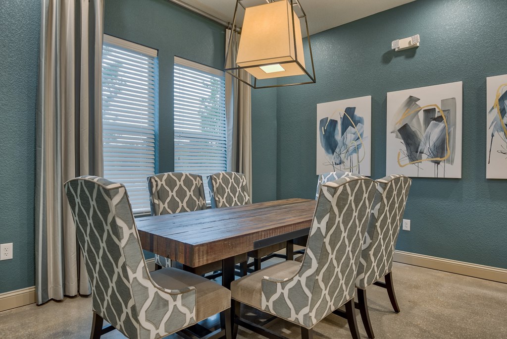 The Clubhouse with a table and seats at Parc at Bentonville