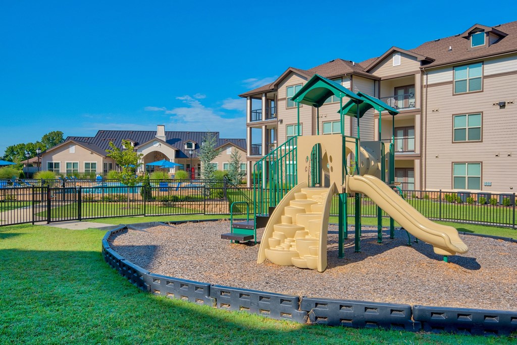 1 & 2-Bedroom Apartments for Rent in Bentonville, AR – Parc at Bentonville – A playground with a slide