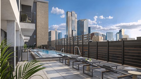 A rooftop pool with a view of the city skyline.