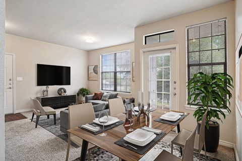 Apartments for Rent in Maumelle, AR 72113– Parc at Maumelle -   A modern dining room with a wooden table.