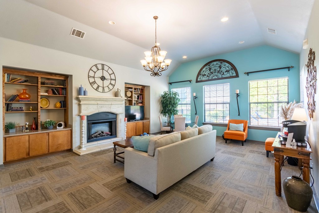 Apartments for Rent in Maumelle, AR 72113– Parc at Maumelle -   Club house with ceiling light and couches and windows