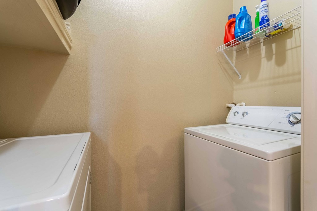 1, 2 & 3-Bedroom Apartments for Rent in Maumelle, AR – Parc at Maumelle – a small laundry room with a washer and dryer