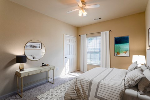 Apartments in Clarksville, TN for Rent - Parc at Clarksville - bedroom with ceiling fan and large window with curtains