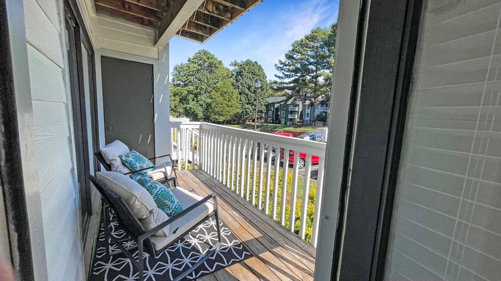 1 Park Central Apartments, Peachtree Corners, Georgia a balcony with a couch and a chair