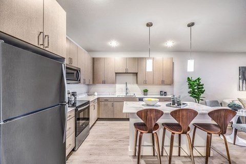 a kitchen with a table and chairs
