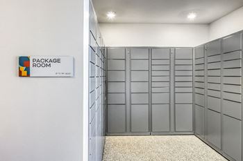 a locker room with rows of lockers and a sign on the wall