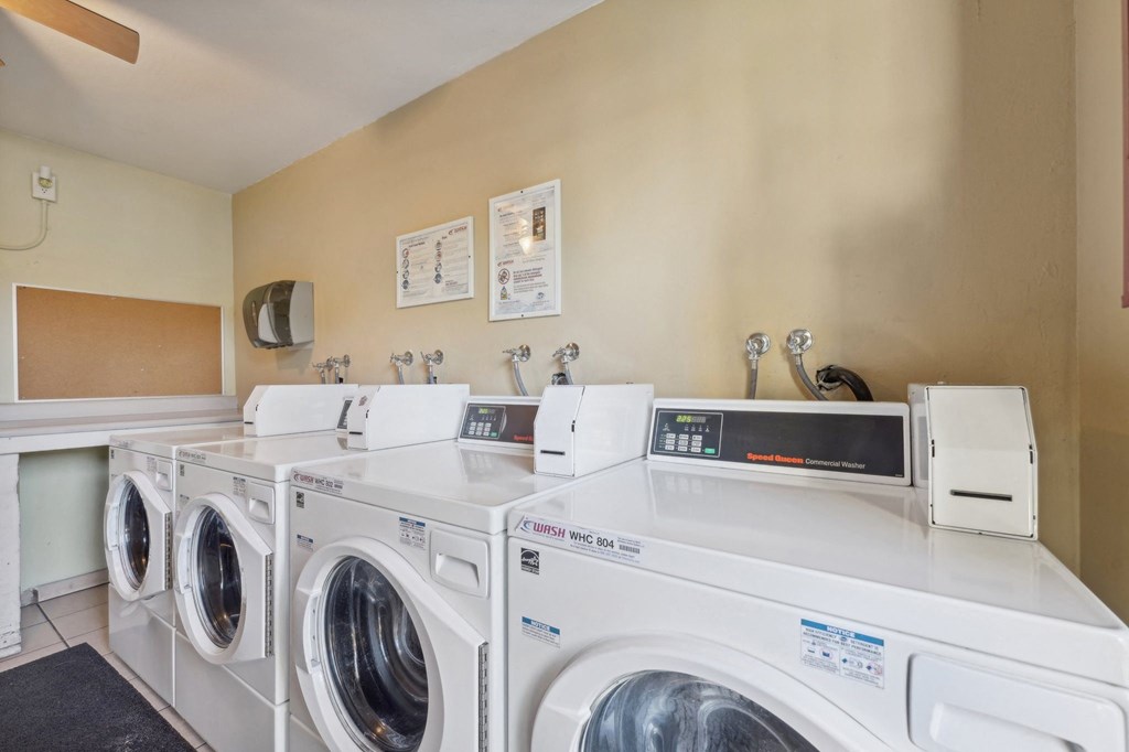 washing machines and dryers in the laundry room of a home