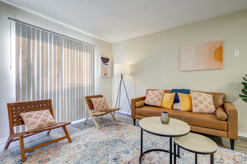 The Pearl at Highland Village Apartments and Townhomes for rent in Jackson, MS photo of a living room with a couch and two chairs