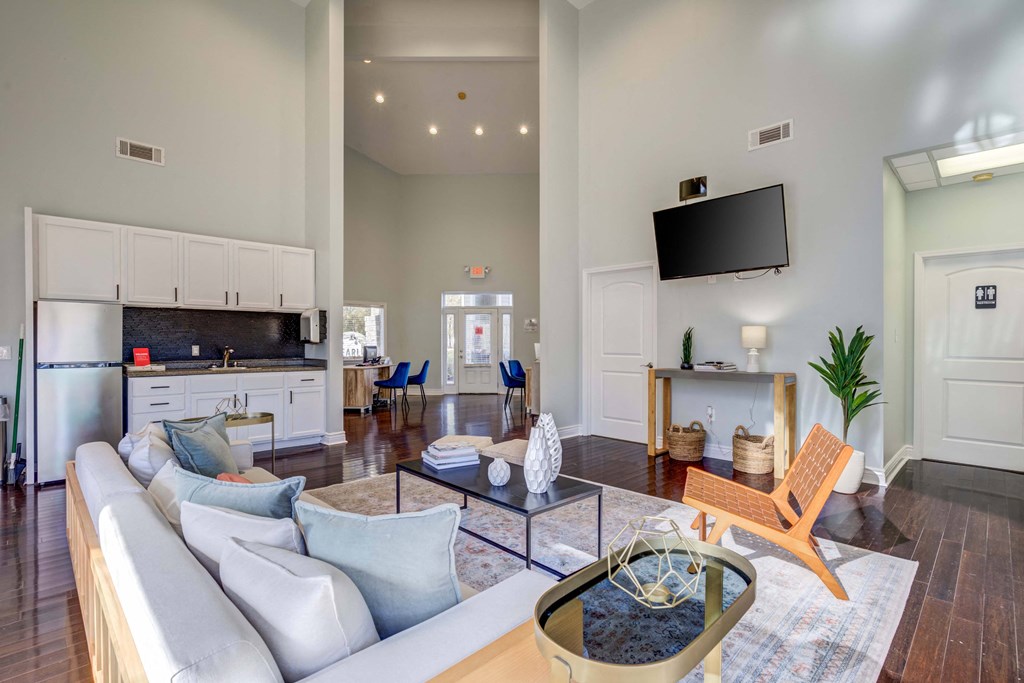 The Pearl at Highland Village Apartments and Townhomes for rent in Jackson, MS photo of clubhouse with seating and a tv
