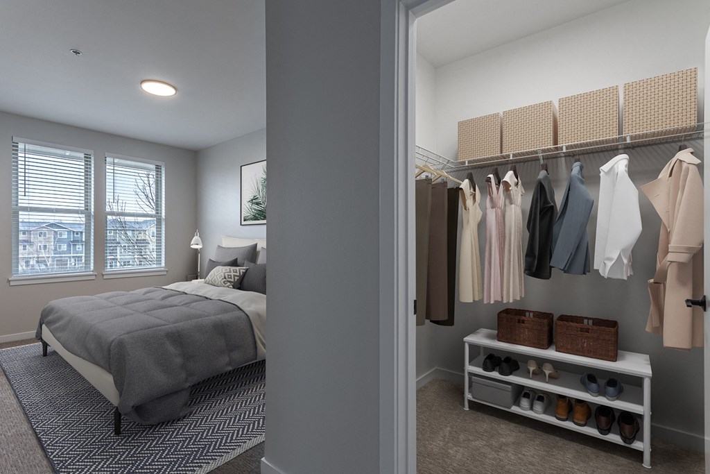 One BR Apartments in Sherwood OR - Cannery Row - Bedroom with Carpeted Floor, Bed, Wall Art, Windows with Blinds, and Walk-In Closet