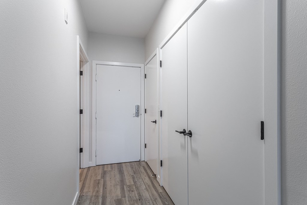 a bedroom with a medium sized bed and two closets