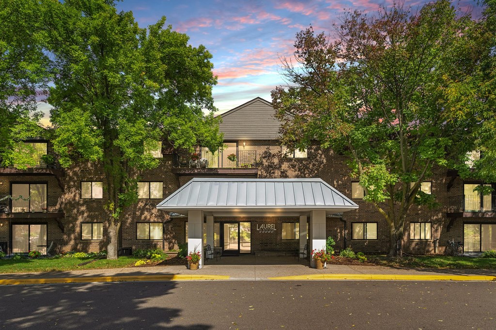 Laurel West End Apartments in Golden Valley, MN photo of a large building with trees in front of it
