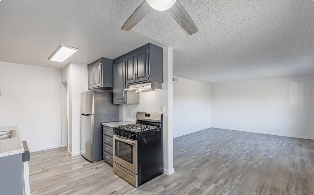 a kitchen and living room in an apartment