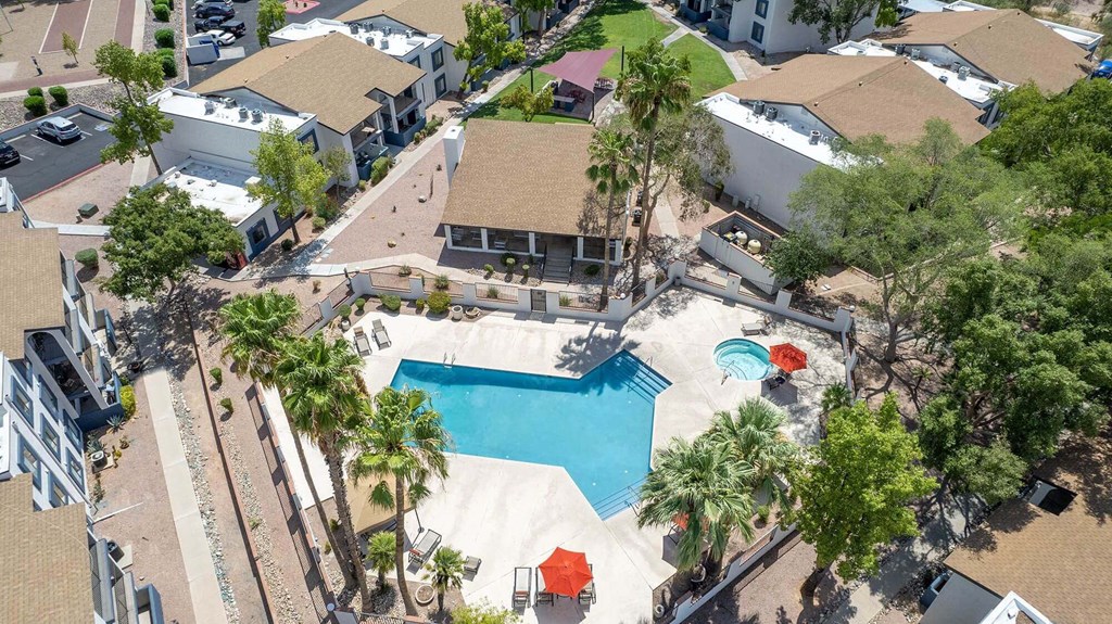 a aerial view of a swimming pool and a house