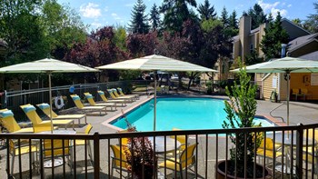 Nickel Creek Apartments in Lynnwood Washington photo of pool with sundeck - Photo Gallery 6