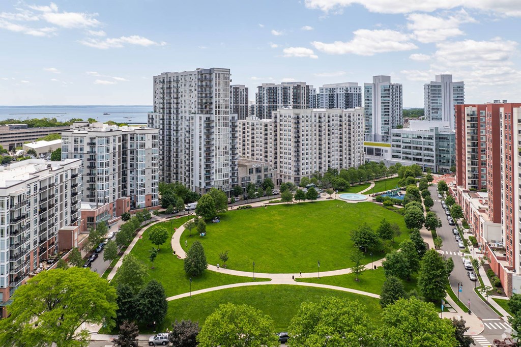 an aerial view of a park in a city with tall buildings