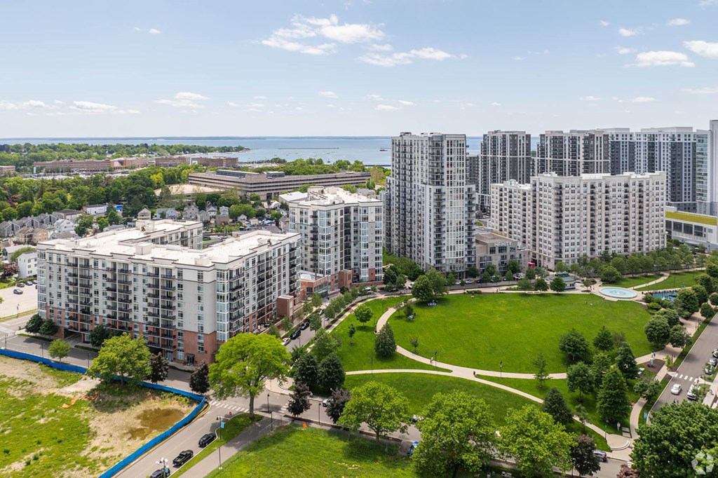 an aerial view of a city with tall buildings and a park