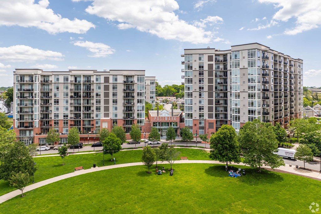 an aerial view of a park with apartment buildings