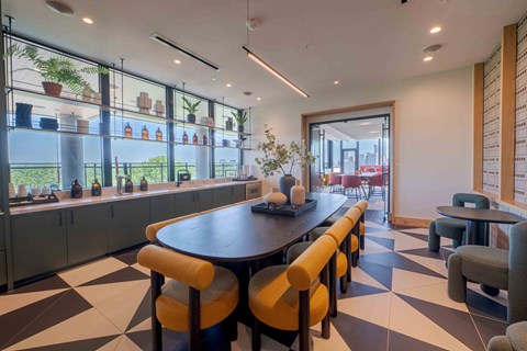 A black and white checkered floor in a modern dining room.