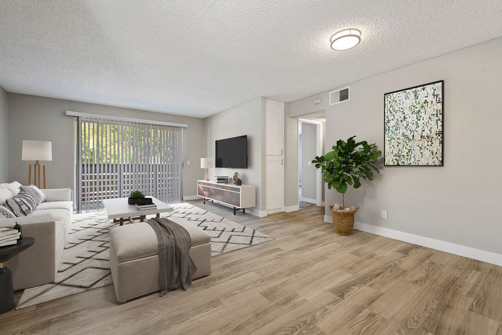 an open living room with a couch and a tv