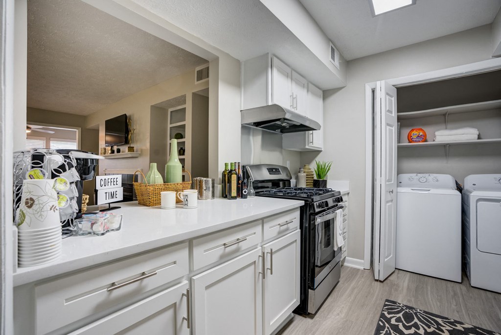 the preserve at ballantyne commons spacious kitchen with stainless steel appliances and white cabinets