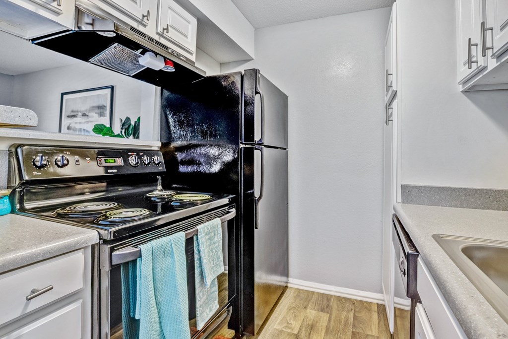 Kitchen with stainless steel appliances at Reserve at Providence apartments in Charlotte near Matthews, NC