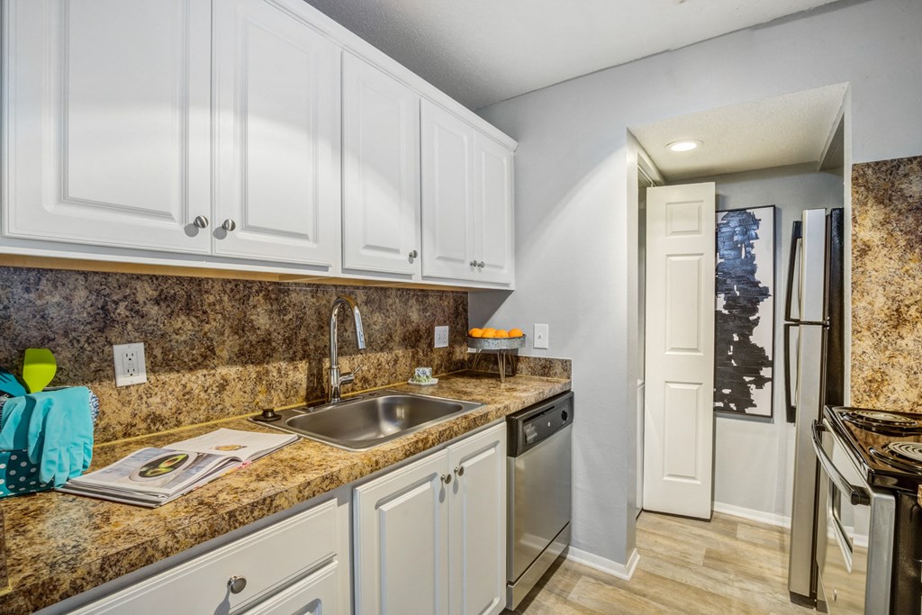 Kitchen with stainless steel appliances at Reserve at Providence apartments in Charlotte near Matthews, NC